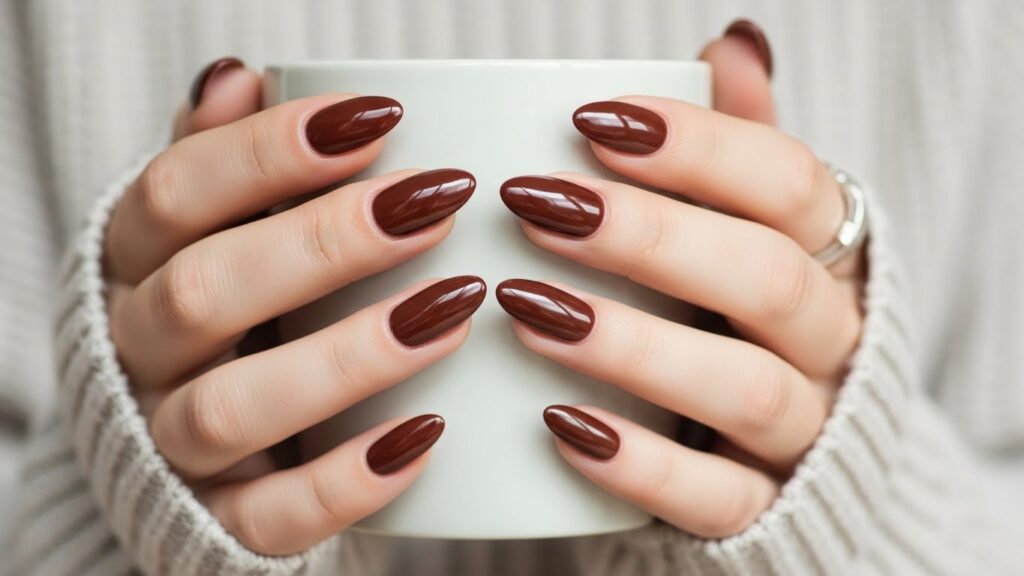 Chocolate brown glossy almond nails for autumn 2025