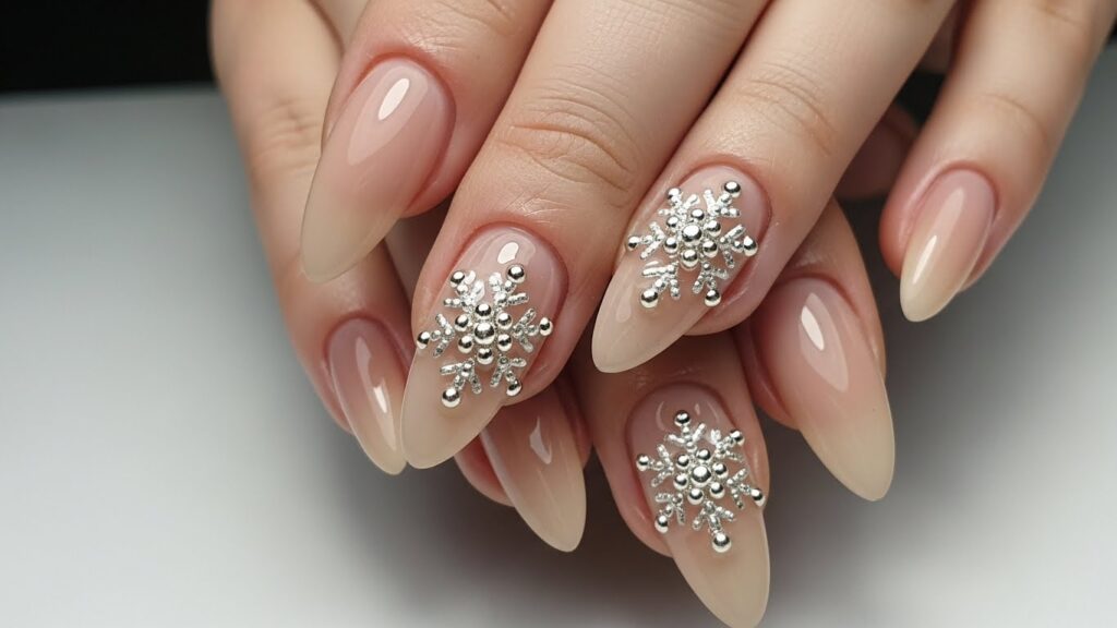 Winter nail ideas for 2025–2026 featuring blue, white, chrome, glitter, and snowflake designs.