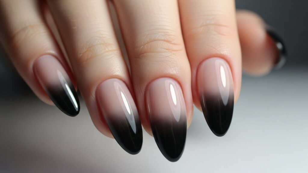 Black ombré nails fading from nude to black
