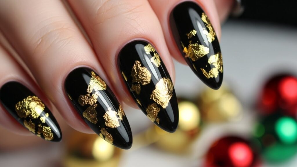 Black nails with gold foil accents