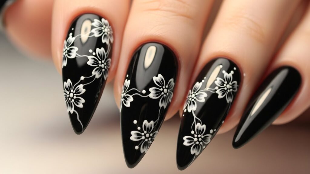 Black nails with white floral nail art