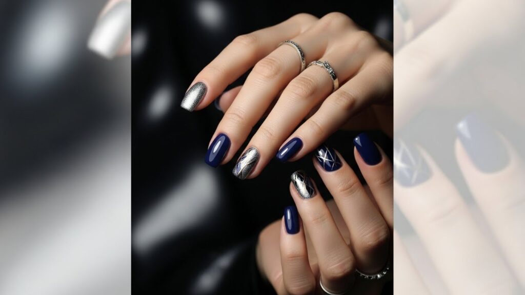 Navy blue nails with subtle glitter accents and artistic details creating a glamorous and bold manicure look