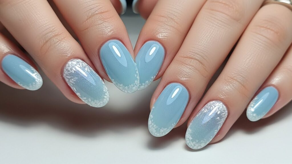 Icy blue short winter nails with frosty tones